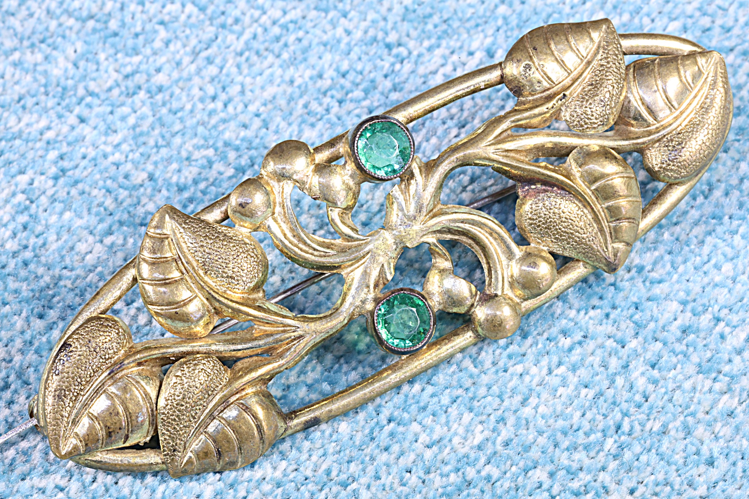 Antiques of artist brass brooch with green stones 20th century