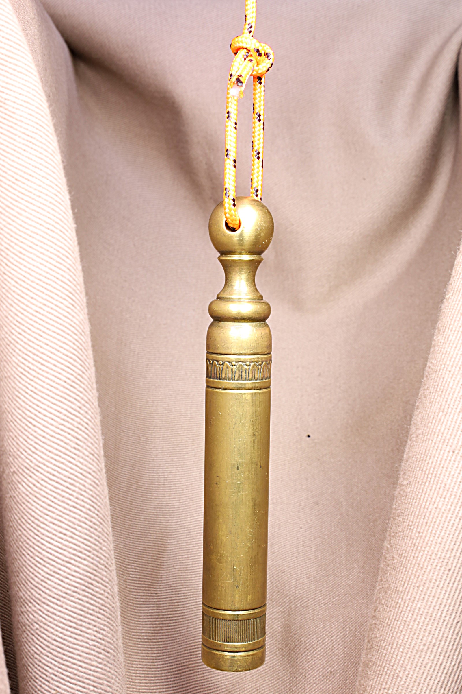 Antiques of long vertical plumb bob horizontally perforated