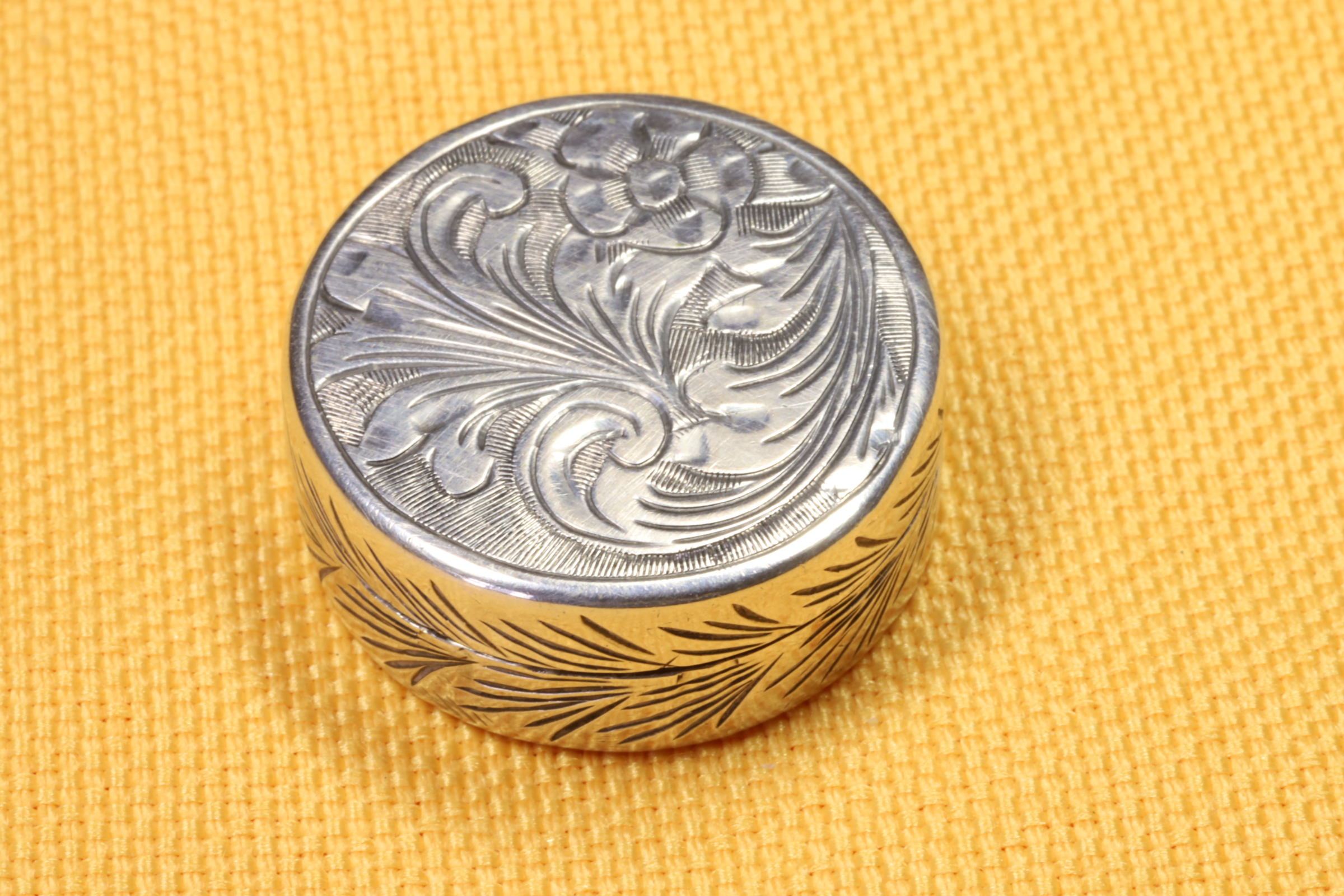 Antiques - ROUND SILVER PILLBOX. CHISELED. (T)